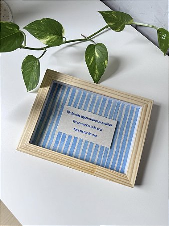 Quadro frase: “Ter um sonho todo azul…”