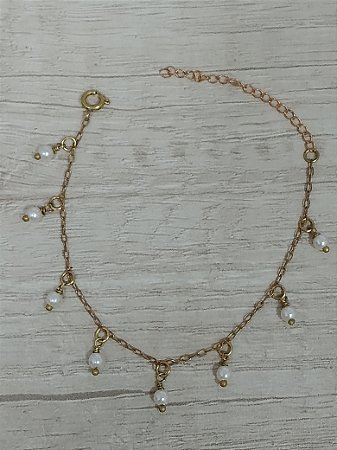 Pulseira pérola pendurada no bruto