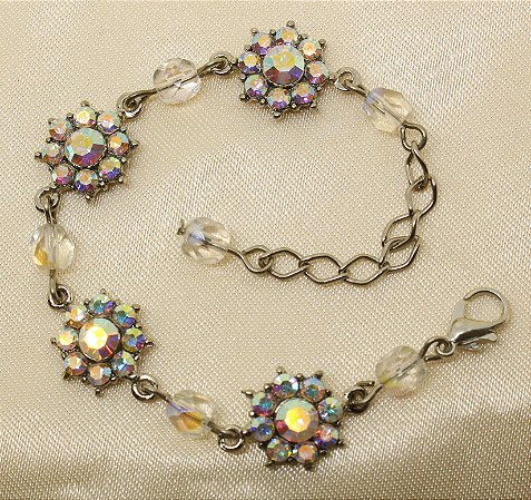 Pulseira flor de strass base prata