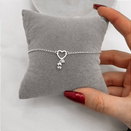Pulseira entremeio coração vazado com pingentes menino e zircônia