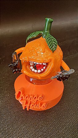 Vidro PuffCo Laranja com PuffCo na mão