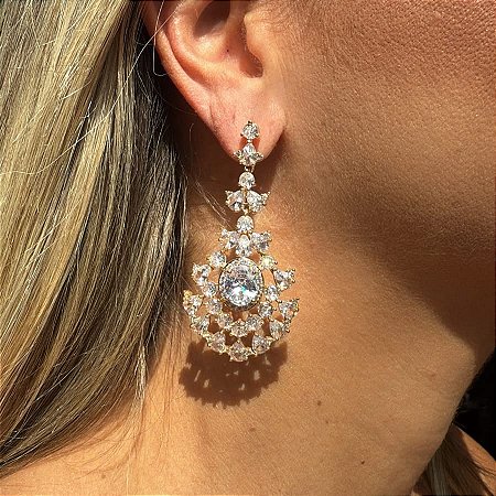 BRINCO FESTA PEDRA OVAL CENTRAL DOURADO