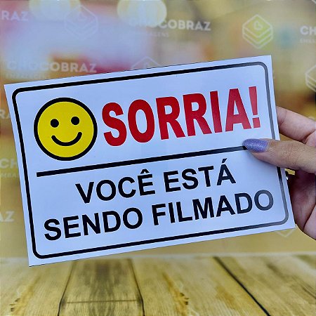ETIQUETA ADESIVO SORRIA VOCÊ ESTÁ SENDO FILMADO 18x12cm ( ADESIVA )