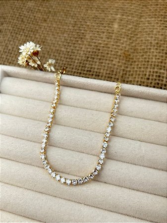 PULSEIRA RIVIERA CRISTAL BANHADA A OURO