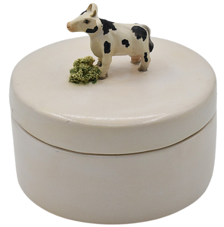 Caixa redonda com aplicação de vaca