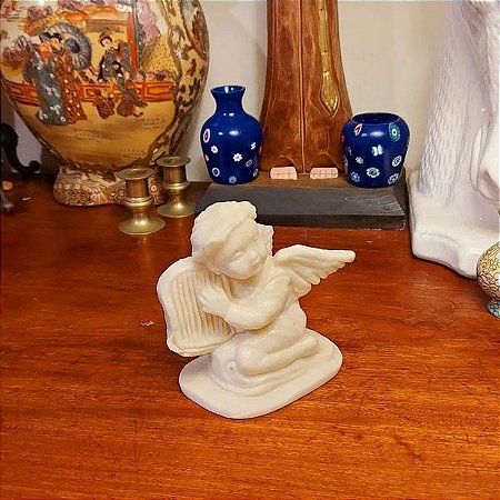 Linda esta escultura em pedra mármore