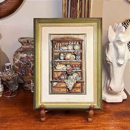 Antigo quadro com representação de itens de cozinha.