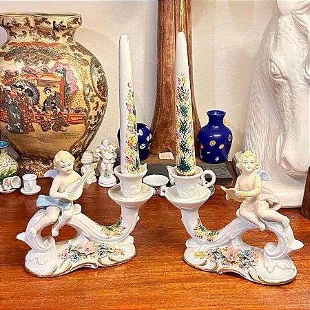 Antigos castiçais em porcelana fria (cada)