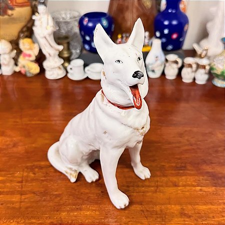 Bibelô em porcelana cachorro.