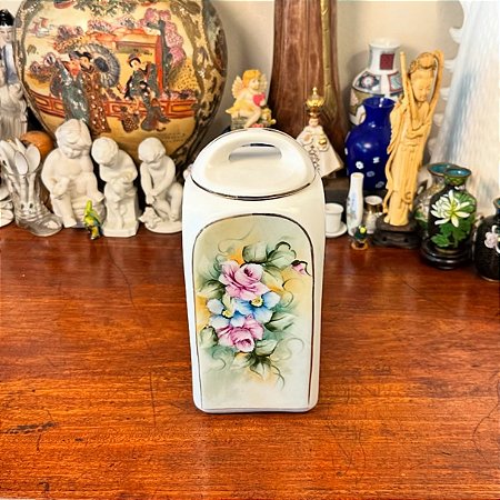 Elegante pote antigo em porcelana.