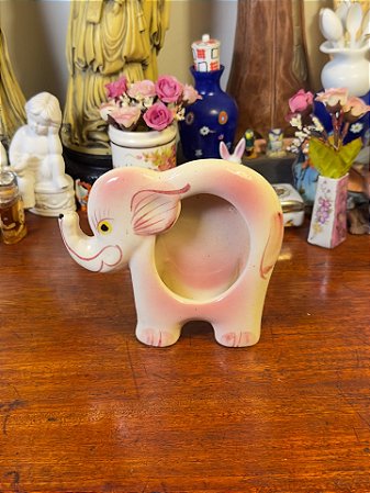 Porta-retrato em cerâmica esmaltada.