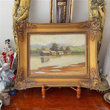 Quadro com pintura a óleo sobre madeira.