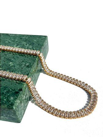 RIVIERA BAGUETE CRISTAL BANHADO A OURO 18K.