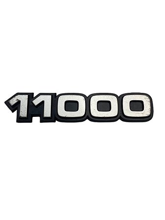 Emblema 11000 do Para-Lama Dianteiro do GM Caminhão 11000 de 1985 a 1990 Original GM 94654770 Novo de Época