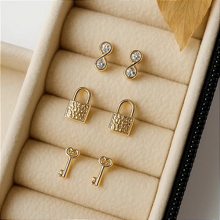 Trio de brinco chave, cadeado e infinito folheados a ouro 18k