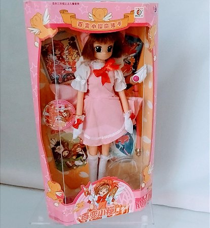 Boneca Sakura cardcaptor de vestido rosa ,28 cm, sem uso, de 2002,  na caixa lacrada.