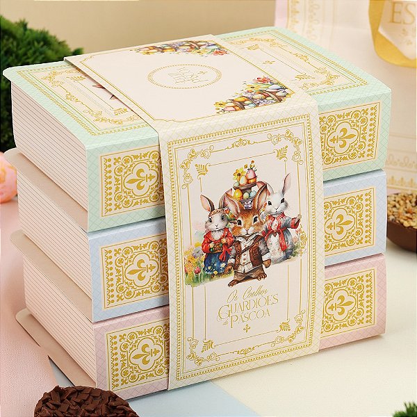 CAIXA 2 OVOS 50GR TRILOGIA: OS COELHOS GUARDIOES DA PASCOA JANGO