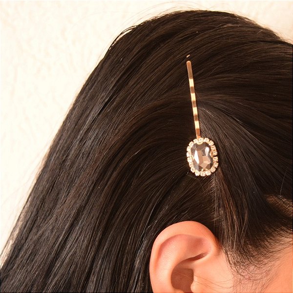 Grampo metal dourado cristais fumê