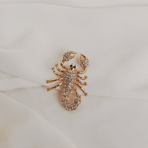 Broche escorpião cristal dourado