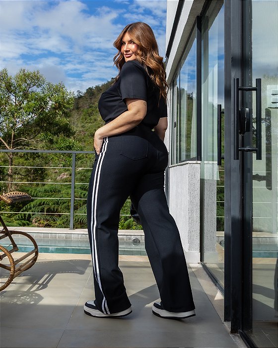 Calça flare faixas