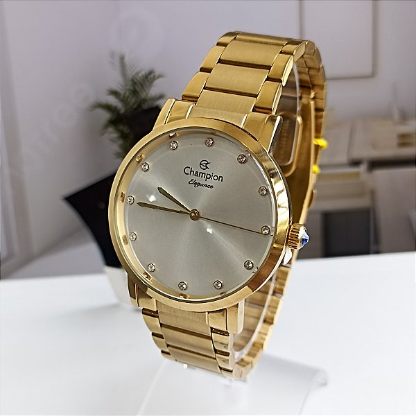 RELOGIO FEMININO DOURADO CHAMPION FUNDO COM DETALHES PEDRAS CN24435G