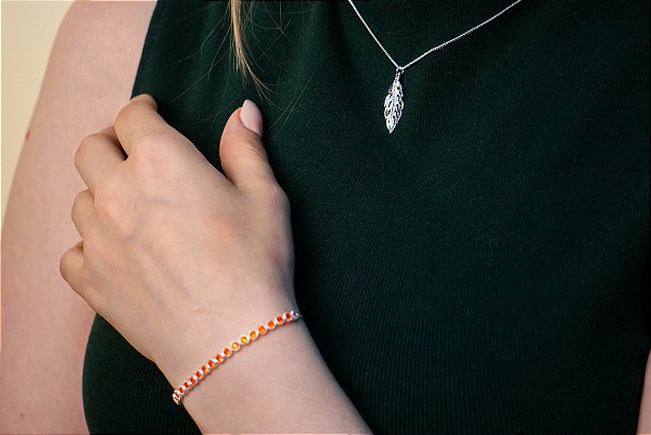 PULSEIRA COM ZIRCÔNIAS LARANJAS