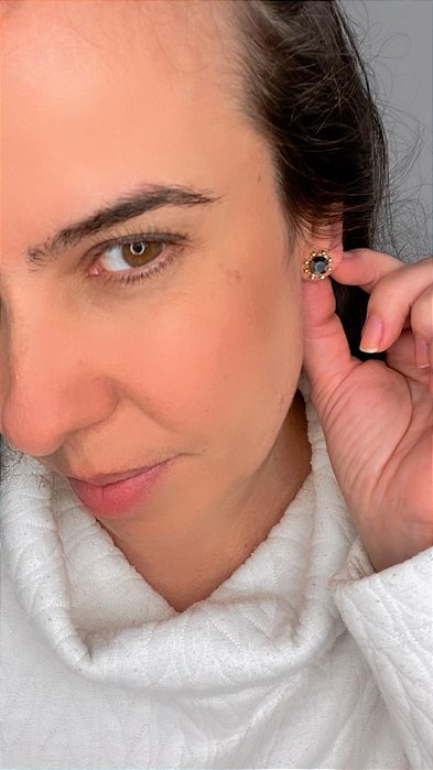 Ponto de luz dourado com bolinhas em volta do strass jet hematite