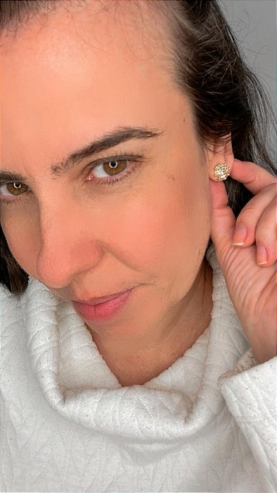 Ponto de luz dourado com bolinhas em volta do strass gohon