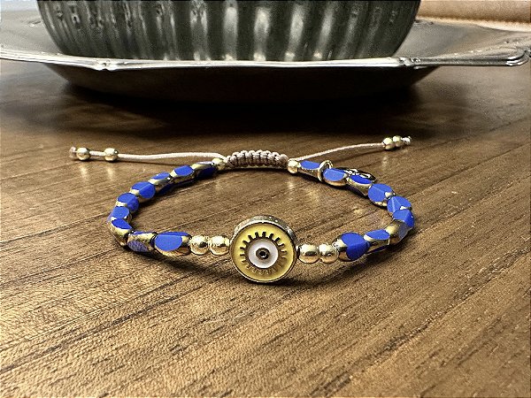 Pulseira Cristais Facetados Azul com Olho Grego Amarelo