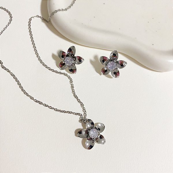 Conjunto flor aço inox detalhe em zircônia