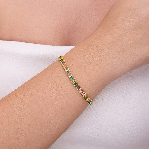 Pulseira rivieira em baguete com zircônia colorido folheada a ouro
