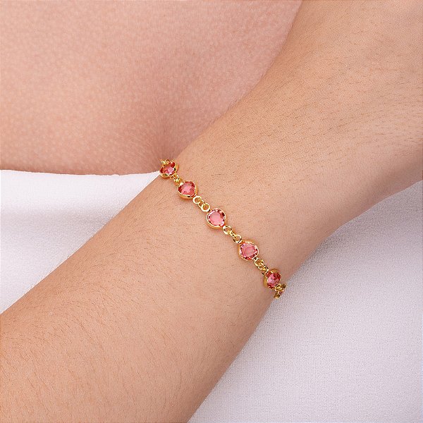 Pulseira com pedra redonda rosa folheado a ouro