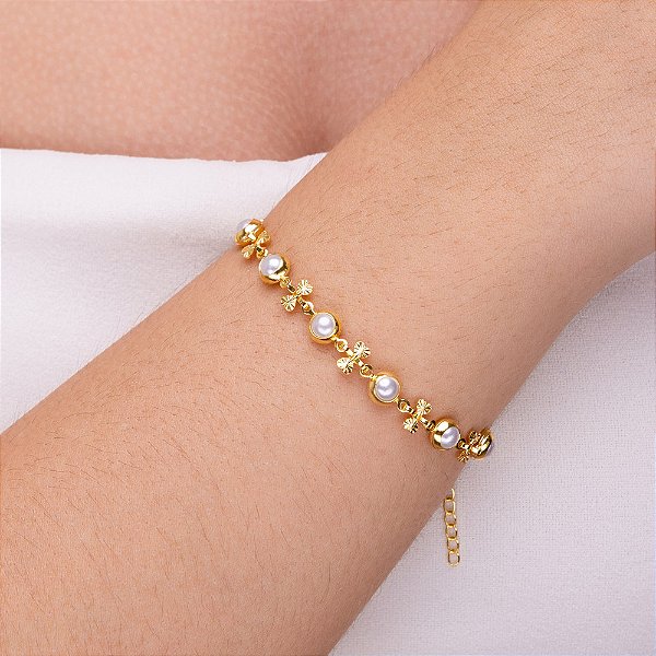 Pulseira perola com entremeio de laço