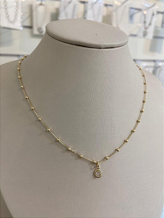 COLAR CHOCKER DE BOLINHAS COM PONTO DE LUZ CRISTAL DOURADA