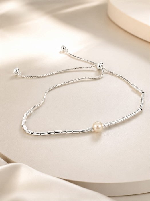 PULSEIRA COM REGUL. TUBINHO COM PEROLA EM PRATA