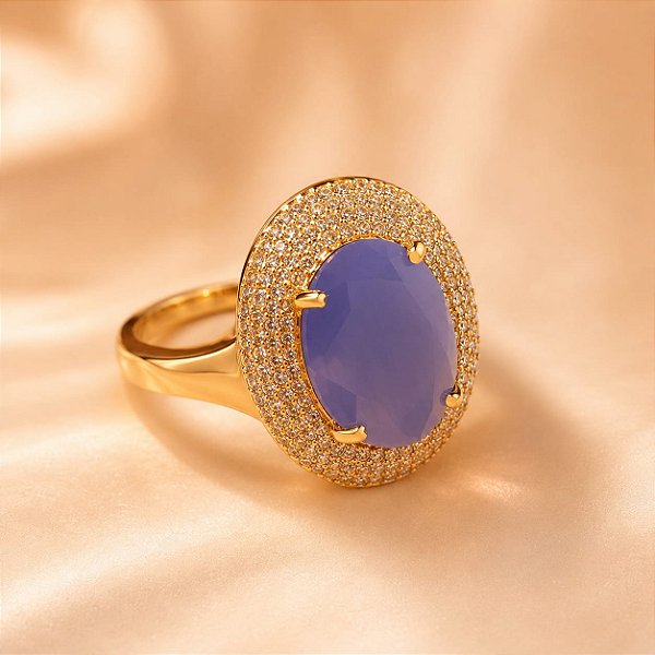 ANEL OVAL C/ ZIRCONIA AZUL CRAVEJADA EM VOLTA