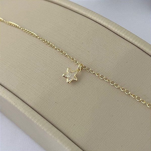 Tornozeleira em banho de ouro 18k com pingente de estrela em zircônia