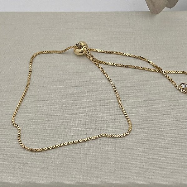 Tornozeleira em banho de ouro 18k em corrente veneziana tradicional em fecho gravata