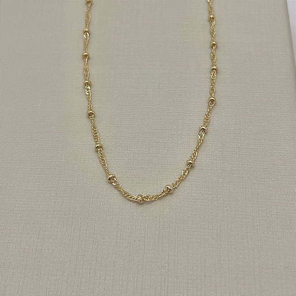 Tornozeleira em banho de ouro 18k em malha fina com bolinhas