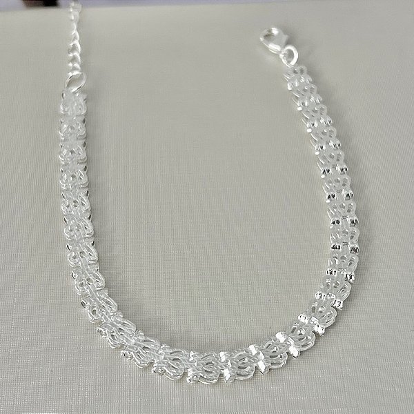 Pulseira de coroas vazadas em banho de prata silver