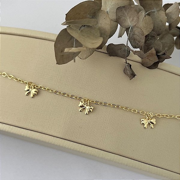 Pulseira de lacinhos em banho de ouro 18k