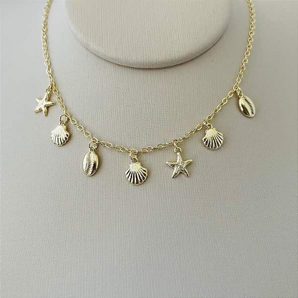 Colar de conchas e estrelas em banho de ouro 18k