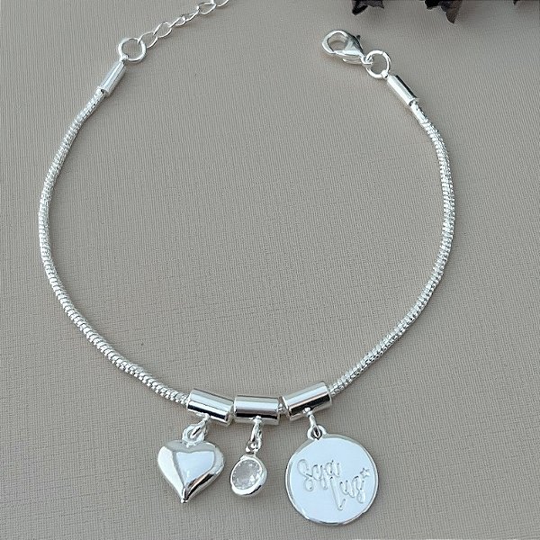 Pulseira com pingentes seja luz, coração e ponto de luz em banho de prata silver