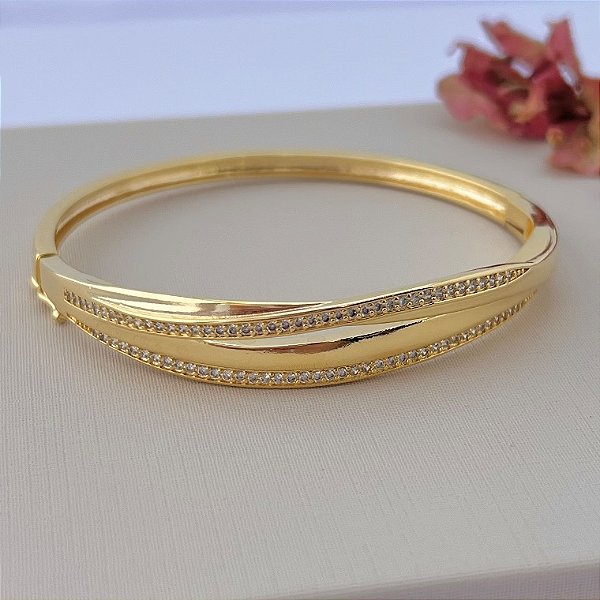 Bracelete ondulado meio vazado cravejado e liso em banho de ouro 18k