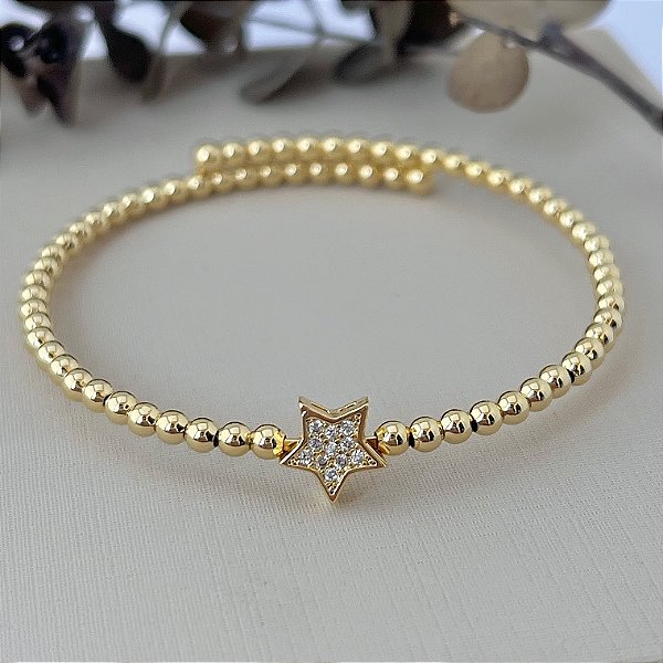 Bracelete de bolinhas com pingente de estrela cravejado em banho de ouro 18k