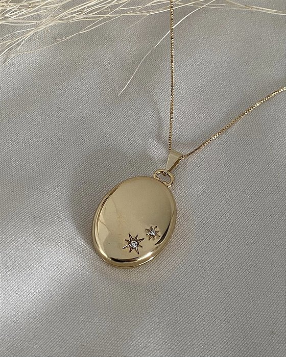 Relicário oval estrelas DOURADO