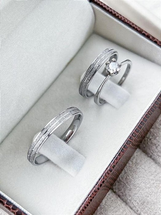Par de aliança Diamantada com friso 3mm + Solitário - Aço Inox