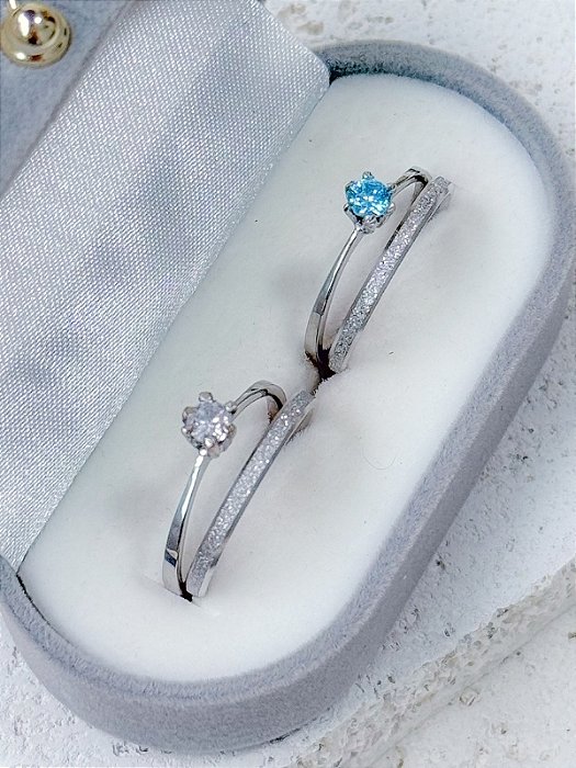 Par de aliança Minilover + Solitários cristal e azul - Aço Inox