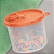 Tupperware Redondinha com Bico Dosador Salmão 500ml - Imagem 1