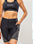 BERMUDA MULTISPORT RUN SEAM PRETA E CINZA 2 BOLSOS FEMININA - Imagem 7